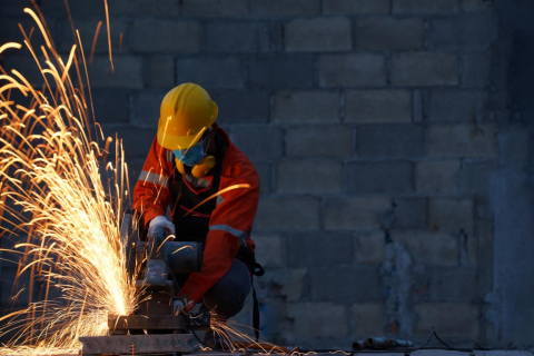 Worker wearing protective mask to Protect Against Covid-19,Spark